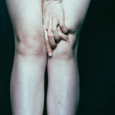 Close up on a person's hands in a calm, focused gesture.